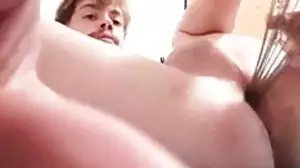 young pig has fun with a kitchen utensil in his