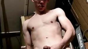 Young man sensually masturbating after pissing on