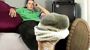 Stroking their dicks while intertwining feet for
