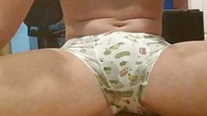 Cute women's knickers wetting on the floor