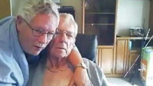 Two grandpas cuddling, kissing and loving - no