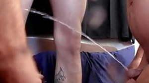 Inked twinks pissing and blowing each others big
