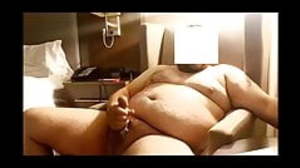Chubby jerking his cock in hotel and cumming