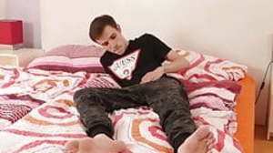 Inked smooth twink stroking his thick cock while