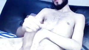 Bearded young Latino edging his huge uncut cock