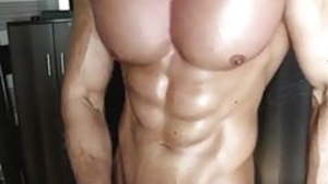 Handsome bodybuilder teasing with his big cock