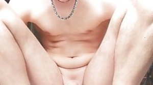 Young boy plays with a dildo