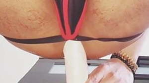 Tight space riding a thick dildo