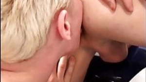 Young car mechanic servicing older gay businessman