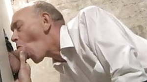 Clothed daddy sucking big dick at gloryhole