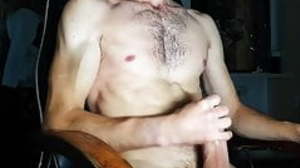 Sporty guy jerks off a big cock