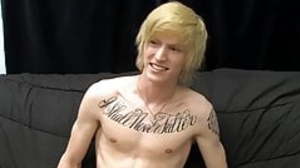 Tattooed twink Dustin jerking off in passionate